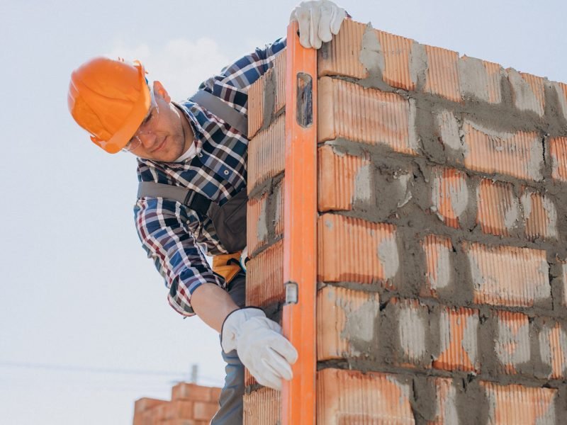 Young craftsman building a house Young craftsman building a house